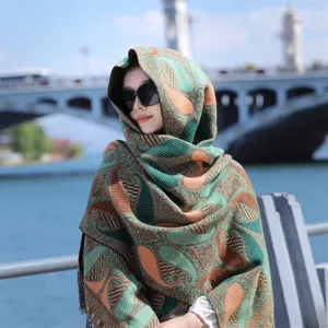 Close-up detail of the thickened ethnic paisley pattern shawl with a soft warm texture