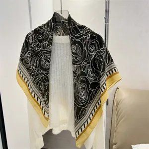 Fashionable rose pattern cotton linen square scarf draped over a white knitted sweater.