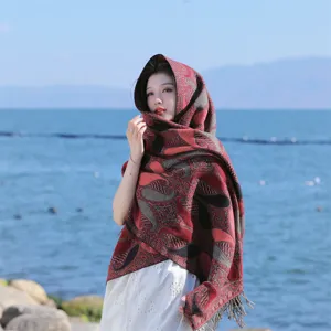 Detailed view of a thick ethnic paisley shawl with fringe, ideal for outdoor travel photography.