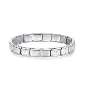 Detailed view of stainless steel Italian charm bracelet with engraved butterfly pattern