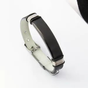 Adjustable stainless steel bracelet with black plate and watch-band style strap.