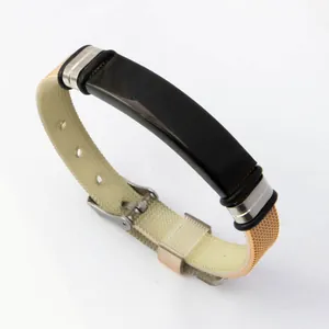 Modern adjustable stainless steel bracelet featuring a sleek black plate and textured strap