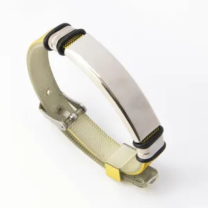Trendy adjustable stainless steel bracelet with a sleek silver plate and textured strap.