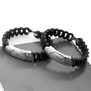 Pair of black silicone and stainless steel bracelets with scorpion and heart motifs