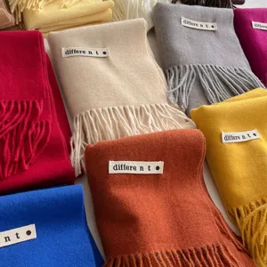 Soft solid color cashmere-like scarf with tassels and decorative tag
