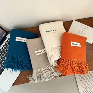 Soft and thick faux cashmere solid color winter scarves with elegant fringe and woven labels