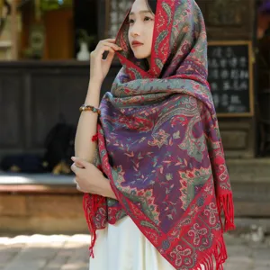 Detailed view of a thick ethnic shawl featuring vintage paisley and floral embroidery patterns