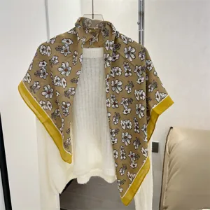Detail view of a 90cm cotton linen square scarf with yellow floral pattern