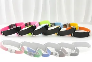 Detail showing multi-colored silicone bracelets with engravable black steel plates