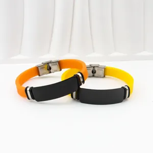 Silicone ID bracelet with engravable black stainless steel plate in orange and yellow