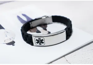 Detailed view of black silicone medical alert bracelet with engraved stainless steel plate