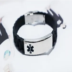 Detail of medical alert silicone bracelet with Star of Life symbol on steel plate