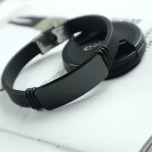 Men's minimalist black silicone bracelet featuring a durable stainless steel ID plate