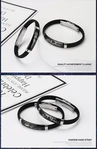 Close-up detail of black silicone zodiac bracelets with engraved stainless steel plates.
