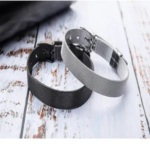 Detail of black and silver adjustable stainless steel mesh bracelets for couples.