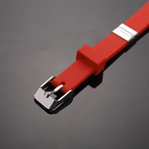 Minimalist red silicone bracelet featuring a polished stainless steel buckle detail