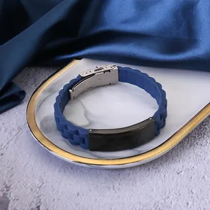Minimalist blue silicone bracelet with black stainless steel plate for men on tray