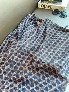 Close-up of bohemian polka dot shawl featuring intricate patterns and soft tassels