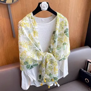 Bohemian floral print sun protection shawl with decorative tassels for women's vacation wear.