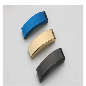Three metallic curved tubes for DIY bracelets in blue, gold, and black plated finishes.