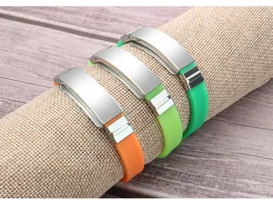 Detail view of colorful silicone sports bracelets with blank stainless steel plates