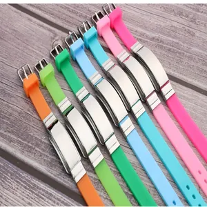 Macro detail of colorful silicone sports wristbands with smooth stainless steel plates.