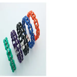 Detailed view of colorful bicycle chain bracelets in five vibrant shades for men