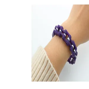 Close-up detail of a 14mm purple and silver bicycle chain link bracelet worn on a wrist