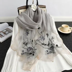 Elegant grey silk wool scarf with intricate floral embroidery and beadwork details