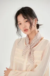 Elegant French retro polka-dot cotton scarf worn by a model for a stylish look