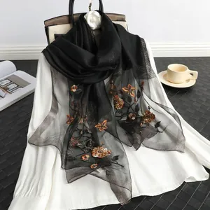 Elegant black silk-wool scarf with vintage orange floral embroidery and beaded detail