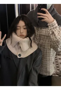 Detailed view of retro cream knitted collar scarf with buttons worn by an Asian model
