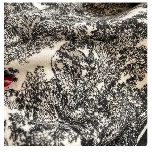 Detailed macro view of vintage black and white Toile de Jouy pattern on soft woven shawl fabric