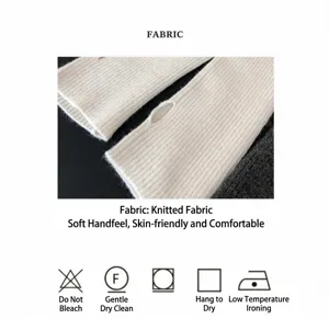 Macro detail of soft white ribbed knit arm warmers and fabric care instructions.