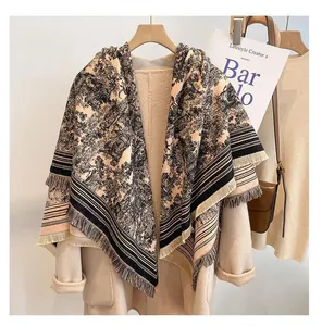 Detail view of a large vintage forest print shawl with soft fringe on a mannequin