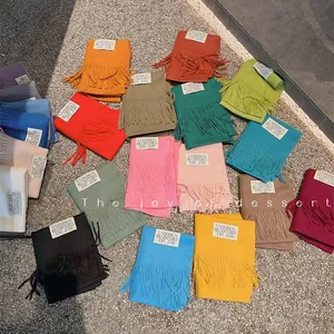 Colorful solid color imitation cashmere scarves with tassels in various shades for autumn