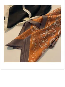 Detail of retro paisley pattern and smooth satin texture on elegant silk scarf