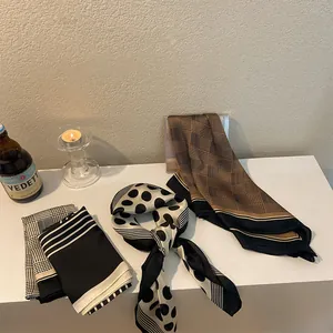 Elegant retro houndstooth and polka dot silk square scarves presented in a lifestyle setting