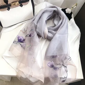 Elegant purple silk wool scarf with intricate flower and butterfly embroidery detail
