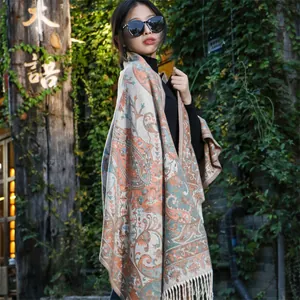 Detailed view of an ethnic paisley shawl worn outdoors for travel photography