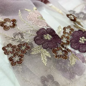 Close-up of exquisite begonia floral embroidery on sheer silk blend scarf fabric.
