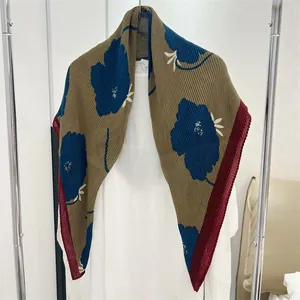 Detail of a 90cm pleated cotton-linen square scarf with large blue floral patterns