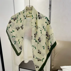 Detailed view of 90cm floral cotton linen square scarf with green borders and vine patterns.