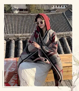 Vintage style plaid hooded cape shawl in grey and burgundy on a traditional roof