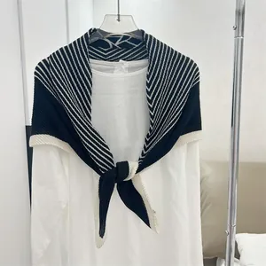 Detail view of a black and white striped pleated 90cm square scarf shawl for women