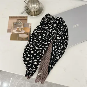 Detailed view of pleated 90cm cotton linen square scarf with black white print