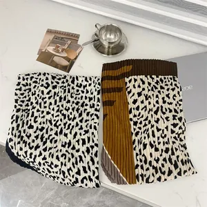 Detail showing the fine pleats and leopard print of this cotton linen square scarf