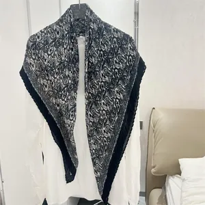 Detailed view of a 90cm paisley cotton linen pleated square scarf with black border