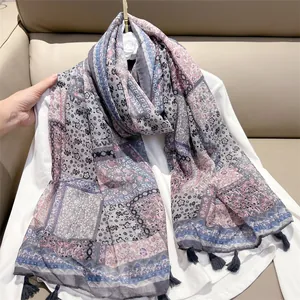 Bohemian style printed scarf with paisley pattern and tassel details for women.