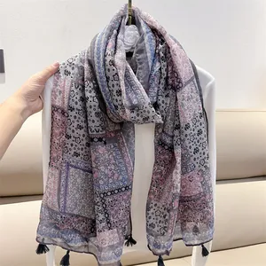 Detail view of vintage ethnic paisley print cotton-linen feel scarf with tassels.